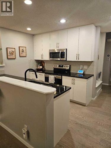 Kitchen with new flooring - 26 Chaparral Valley Common Se, Calgary, AB - Indoor Photo Showing Kitchen