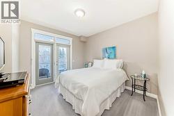 Primary bedroom with balcony access - 