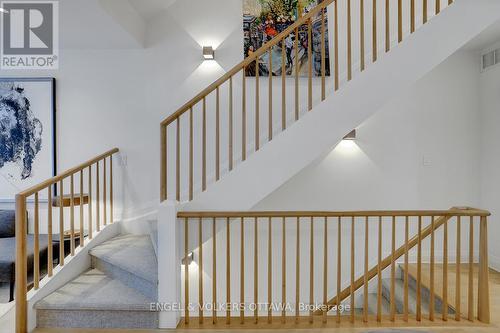 Custom maple railing and wool carpeted stairs - 449 Edison Avenue, Ottawa, ON - Indoor Photo Showing Other Room