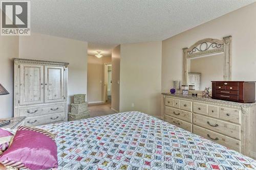7 Scotia Landing Nw, Calgary, AB - Indoor Photo Showing Bedroom