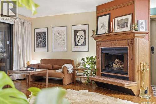 101 222 Saskatchewan Crescent E, Saskatoon, SK - Indoor Photo Showing Living Room With Fireplace