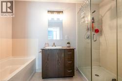Ensuite with soaker tub and walk-in shower. - 