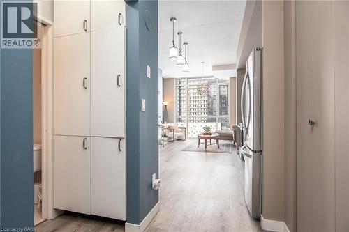 Pantry storage and front hall closet. - 191 King Street S Unit# 702, Waterloo, ON - Indoor Photo Showing Other Room