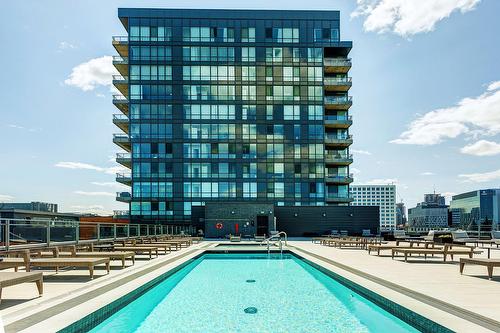 Pool - 214-360 Rue Atateken, Montréal (Ville-Marie), QC - Outdoor With In Ground Pool With Balcony