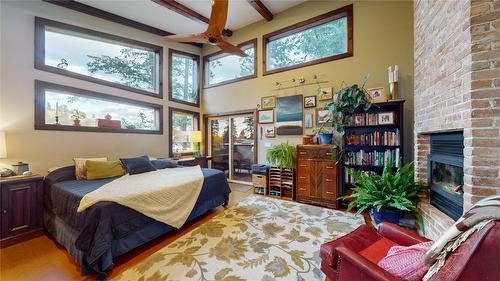 166 304Th Avenue, Kimberley, BC - Indoor Photo Showing Bedroom With Fireplace