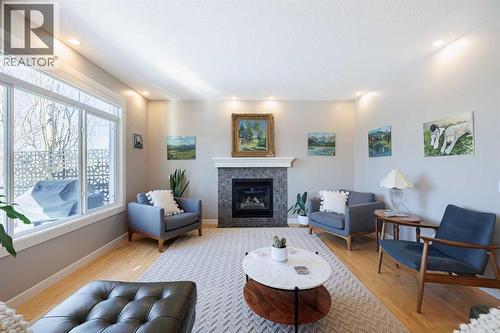 98 Tuscany Estates Crescent Nw, Calgary, AB - Indoor Photo Showing Living Room With Fireplace