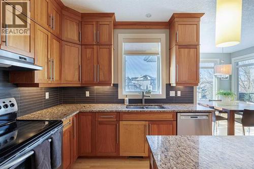 98 Tuscany Estates Crescent Nw, Calgary, AB - Indoor Photo Showing Kitchen With Stainless Steel Kitchen With Double Sink With Upgraded Kitchen