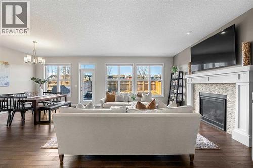 206 Mahogany Passage Se, Calgary, AB - Indoor Photo Showing Living Room With Fireplace