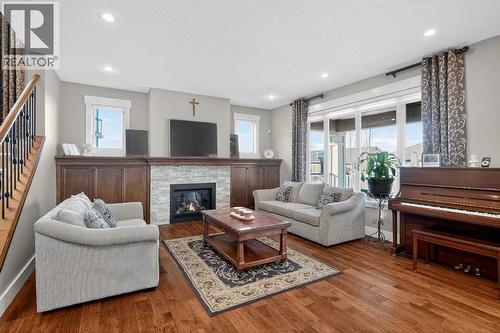 72 Rockcliff Grove Nw, Calgary, AB - Indoor Photo Showing Living Room With Fireplace