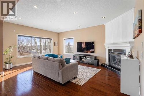 157 Hidden Creek Road Nw, Calgary, AB - Indoor Photo Showing Living Room With Fireplace