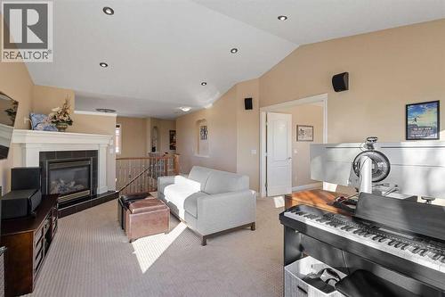 157 Hidden Creek Road Nw, Calgary, AB - Indoor Photo Showing Living Room With Fireplace
