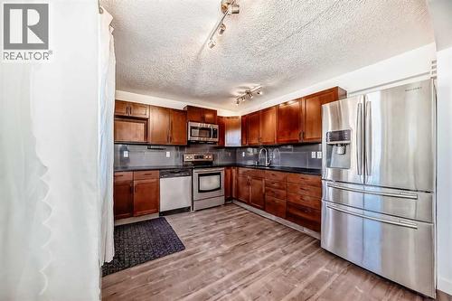 60 Erin Mount Crescent Se, Calgary, AB - Indoor Photo Showing Kitchen