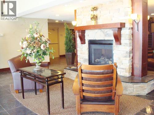 1500 Mcdonald Avenue Unit# 122, Fernie, BC - Indoor Photo Showing Living Room With Fireplace