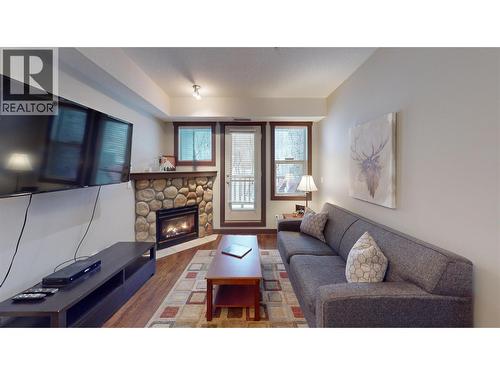 1500 Mcdonald Avenue Unit# 122, Fernie, BC - Indoor Photo Showing Living Room With Fireplace