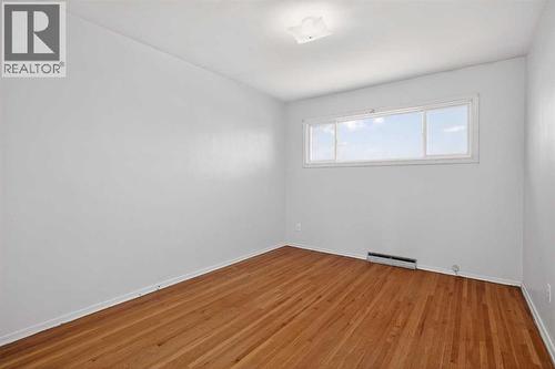 44 Winslow Crescent Sw, Calgary, AB - Indoor Photo Showing Other Room