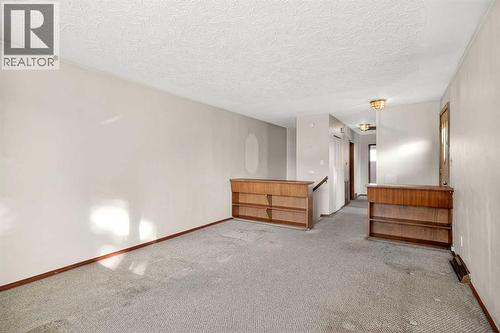 44 Winslow Crescent Sw, Calgary, AB - Indoor Photo Showing Other Room