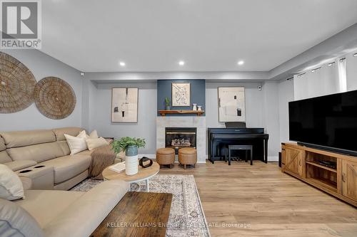 128 West Side Drive, Clarington (Bowmanville), ON - Indoor Photo Showing Living Room With Fireplace