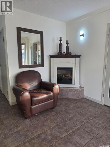 205 701 Henry Street, Estevan, SK - Indoor With Fireplace