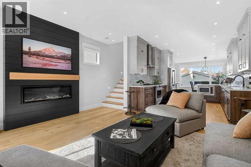124 26 Avenue Ne, Calgary, AB - Indoor Photo Showing Living Room With Fireplace