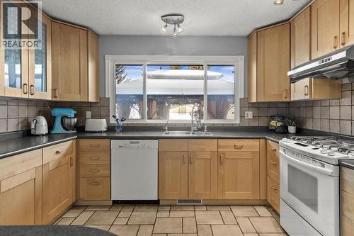 136 Parkglen Crescent Se, Calgary, AB - Indoor Photo Showing Kitchen With Double Sink
