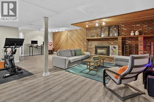 136 Parkglen Crescent Se, Calgary, AB - Indoor Photo Showing Gym Room With Fireplace