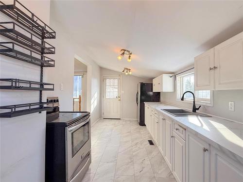 852 5Th Street, Brandon, MB - Indoor Photo Showing Kitchen With Double Sink