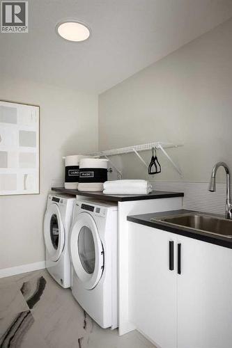 17 Amblefield View Nw, Calgary, AB - Indoor Photo Showing Laundry Room