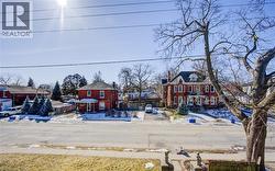 View of front of house featuring brick siding and a residential view - 