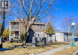 View of front of house featuring a balcony - 
