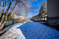 Yard covered in snow featuring a fenced backyard - 