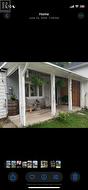 Seller photo of welcoming front porch. - 