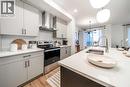 132 Southbow Village Way, Cochrane, AB  - Indoor Photo Showing Kitchen With Double Sink With Upgraded Kitchen 