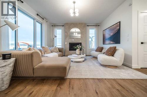132 Southbow Village Way, Cochrane, AB - Indoor Photo Showing Living Room With Fireplace