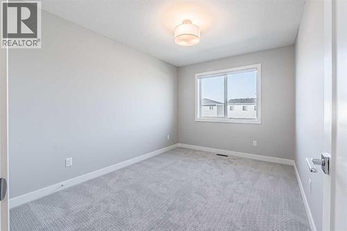 129 Dawson Wharf View, Chestermere, AB - Indoor Photo Showing Other Room