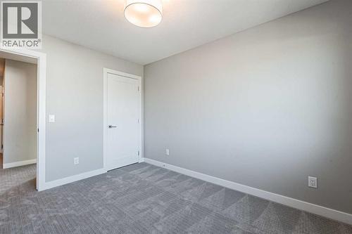 129 Dawson Wharf View, Chestermere, AB - Indoor Photo Showing Other Room
