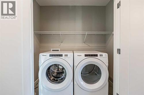 129 Dawson Wharf View, Chestermere, AB - Indoor Photo Showing Laundry Room