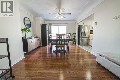 Dining space with dark wood finished floors, a ceiling fan, and baseboard heating - 143 Fairfield Avenue, Hamilton, ON - Indoor Photo Showing Dining Room