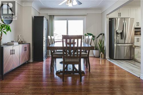 Dining space featuring dark wood-style floors and ceiling fan - 143 Fairfield Avenue, Hamilton, ON - Indoor Photo Showing Dining Room