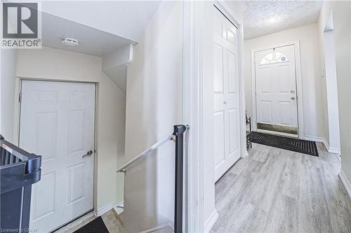 Foyer featuring a textured ceiling and light wood-style flooring - 143 Fairfield Avenue, Hamilton, ON - Indoor Photo Showing Other Room