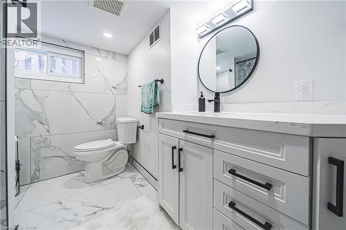 Full bathroom featuring vanity, light marble finish flooring, recessed lighting, and beverage cooler - 143 Fairfield Avenue, Hamilton, ON - Indoor Photo Showing Bathroom