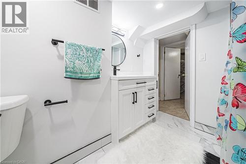 Bathroom with vanity and light marble finish flooring - 143 Fairfield Avenue, Hamilton, ON - Indoor Photo Showing Bathroom