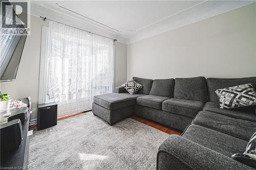 Living room featuring wood finished floors - 143 Fairfield Avenue, Hamilton, ON - Indoor Photo Showing Living Room