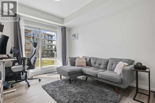 1104, 220 Seton Grove Se, Calgary, AB - Indoor Photo Showing Living Room