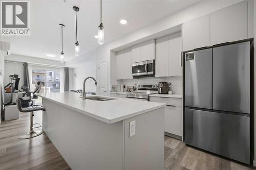 1104, 220 Seton Grove Se, Calgary, AB - Indoor Photo Showing Kitchen With Double Sink With Upgraded Kitchen