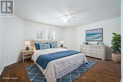 Virtually staged main level Primary Bedroom - 