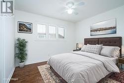Virtually staged Main Floor 3rd Bedroom. - 