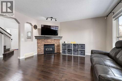 815 Tuscany Drive Nw, Calgary, AB - Indoor Photo Showing Living Room With Fireplace