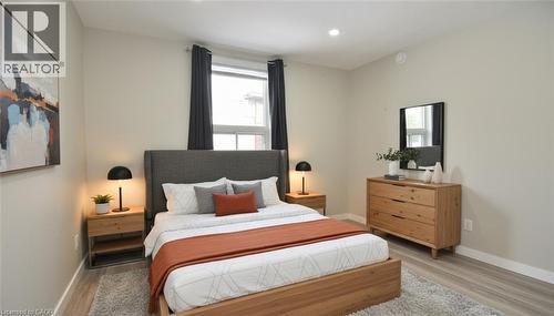 Bedroom featuring light wood-type flooring, multiple windows, and recessed lighting - 371 Fairfield Avenue, Hamilton, ON - Indoor Photo Showing Bedroom