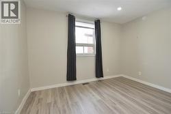 Unfurnished room featuring light wood-style floors and recessed lighting - 