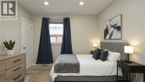 Bedroom with light wood finished floors and recessed lighting - 371 Fairfield Avenue, Hamilton, ON - Indoor Photo Showing Bedroom